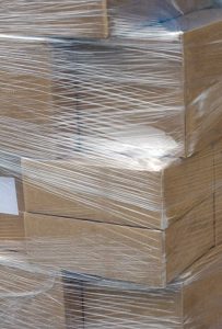 Moving boxes wrapped in wrapping plastic