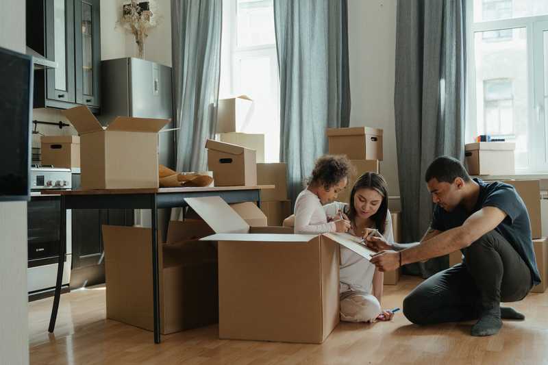 Man and woman pack a box
