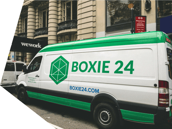 A van with the Boxie24 logo on it.